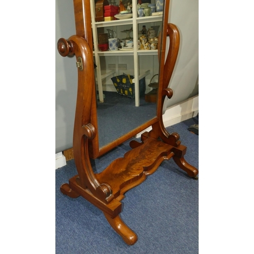 644 - A Victorian mahogany cheval mirror with carved scroll supports, scallop shaped undertier, on splayed... 