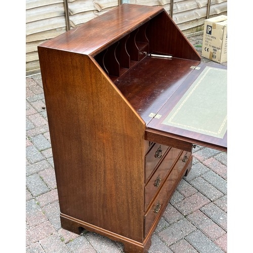 5078 - A reproduction mahogany bureau with fall front, 4 long drawers below on bracket feet, 77cm wide, 46c... 