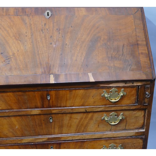 5087 - A George III mahogany bureau with banded decoration, fall front enclosing drawers and pigeon holes, ... 