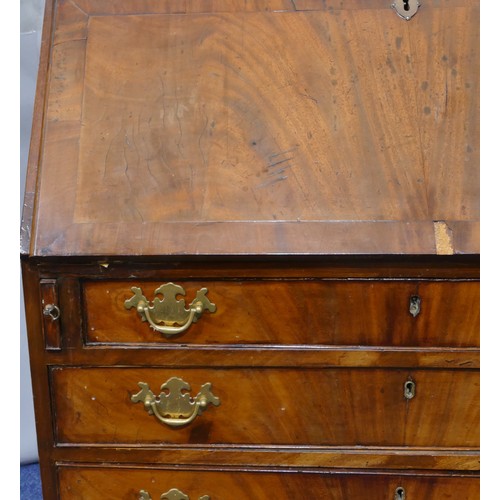 5087 - A George III mahogany bureau with banded decoration, fall front enclosing drawers and pigeon holes, ... 