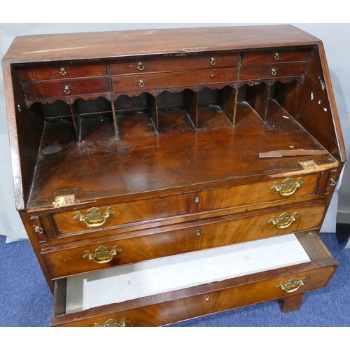 5087 - A George III mahogany bureau with banded decoration, fall front enclosing drawers and pigeon holes, ... 