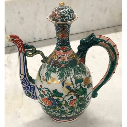 94 - An Oriental Round Bulbous thin necked trumpet shaped coffee pot on white ground with multi-coloured,... 