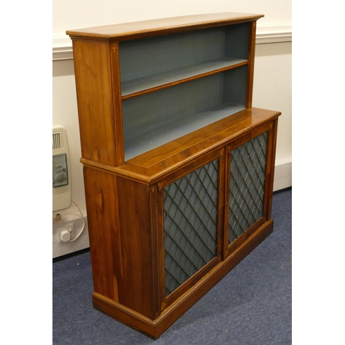 5090 - A 19th Century walnut bookcase with inlaid scroll motifs and banding, open shelved back above 2 gilt... 