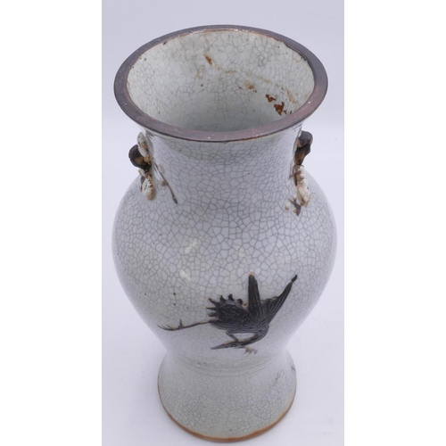 99 - A 19/20th Century Chinese round and bulbous thin necked trumpet shaped Crackleware vase with raised ... 