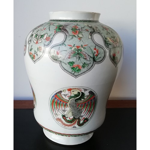 102 - An 18th/19th Century Kangxi round bulbous lidded hinged jar on white ground with multi-coloured butt... 