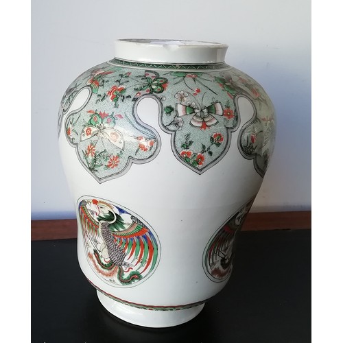 102 - An 18th/19th Century Kangxi round bulbous lidded hinged jar on white ground with multi-coloured butt... 