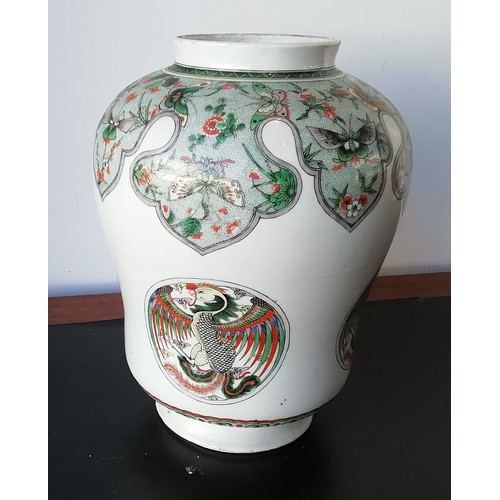 102 - An 18th/19th Century Kangxi round bulbous lidded hinged jar on white ground with multi-coloured butt... 