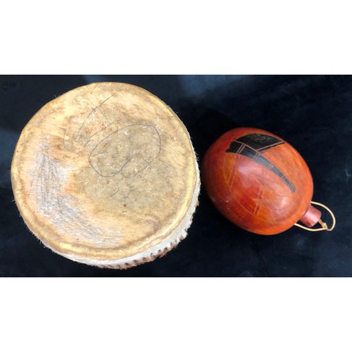 6004 - An African bongo drum with hide skin, 36cm high, 15.5cm diameter and an African gourd with stopper.