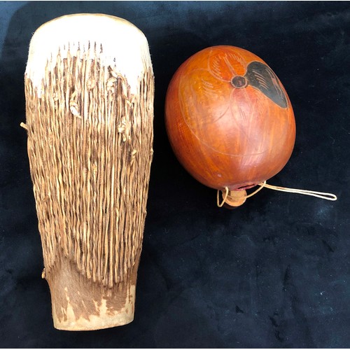 6004 - An African bongo drum with hide skin, 36cm high, 15.5cm diameter and an African gourd with stopper.