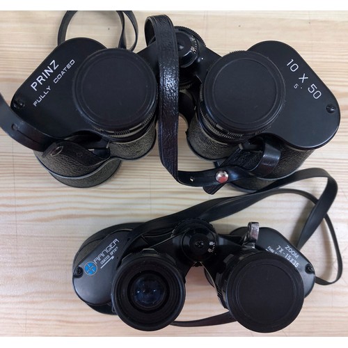 6016 - 2 pairs of binoculars with cases Prinz 10 x 50 (1 lens cap missing) and Ranger zoom 7 x 15x35. (2)