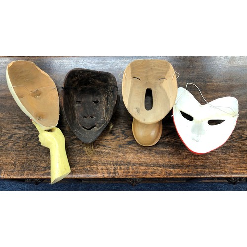 6020 - 3 wood masks and 1 other mask. (4)