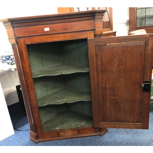 6065 - A George III oak hanging straight front corner cupboard, inlaid shell motif and parquetry banding, r... 