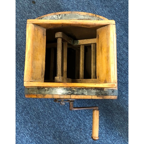 6073 - A wooden butter churner with turning handle etc, 44cm high.