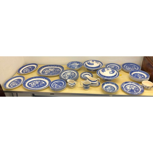 6072 - A quantity of blue and white china, including Willow Pattern etc, 4 serving plates, 2 lidded tureens... 