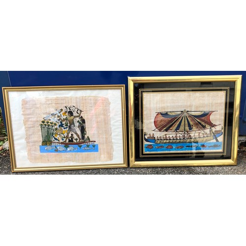 6107 - 2 Egyptian prints on papyrus in gilt frames.