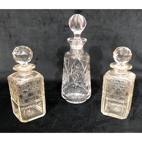 6119 - A pair of cut glass decanters and 1 other cut glass decanter. (3)