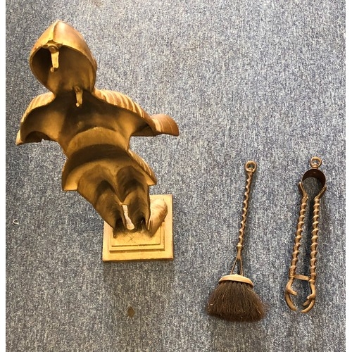 6113 - A set of brass irons in form of a knight in suit of armour with 1 brush and set of tongs to the back... 