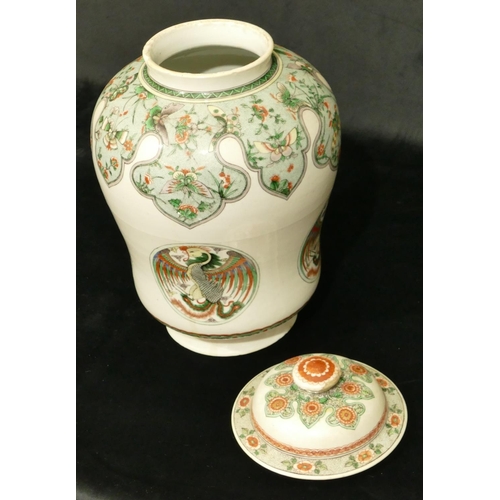 102 - An 18th/19th Century Kangxi round bulbous lidded hinged jar on white ground with multi-coloured butt... 