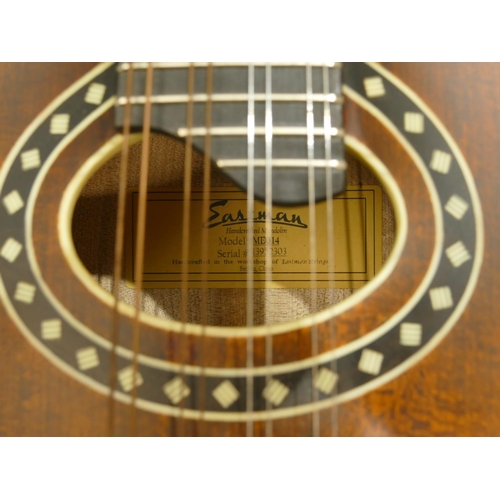 An Eastman 8string mandolin with Mother of Pearl inlay to fretwork, model md314, serial number 1395