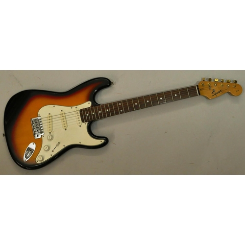 1076 - Squire Strat by Fender 6-string electric guitar, overall length 99cm.