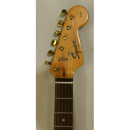 1076 - Squire Strat by Fender 6-string electric guitar, overall length 99cm.