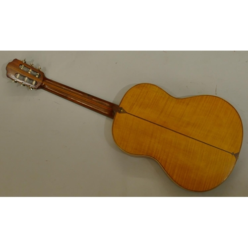 1092 - A classical acoustic Spanish guitar with parquetry decoration and pierced ivory centre in fitted cas... 