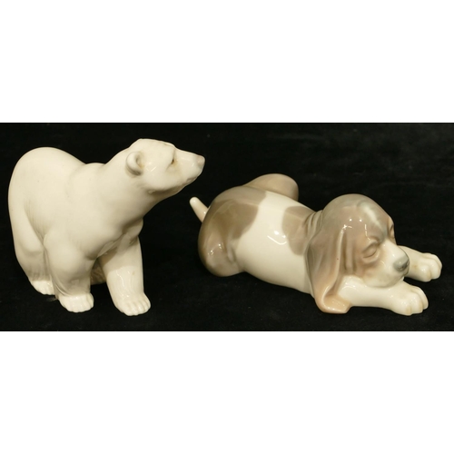 111 - A Lladro figure of a puppy, 12cm long and a Lladro figure of a polar bear, 9.5cm high. (2)