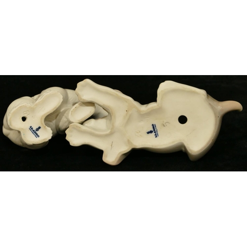 111 - A Lladro figure of a puppy, 12cm long and a Lladro figure of a polar bear, 9.5cm high. (2)