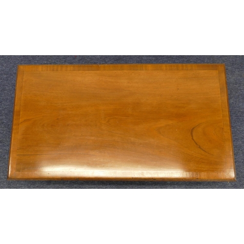 1154 - A mahogany rectangular shaped coffee table with banded top, brush slides to each end on square chamf... 