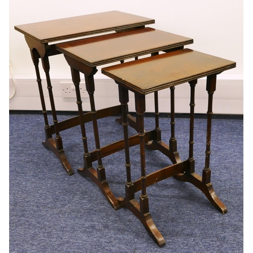 1155 - A nest of 3 mahogany rectangular shaped coffee tables with banded tops, turned supports and splayed ... 