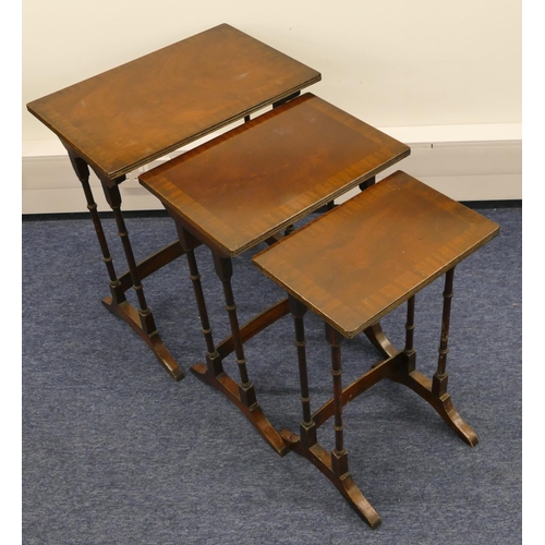 1155 - A nest of 3 mahogany rectangular shaped coffee tables with banded tops, turned supports and splayed ... 