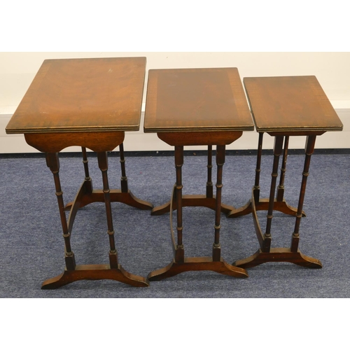 1155 - A nest of 3 mahogany rectangular shaped coffee tables with banded tops, turned supports and splayed ... 