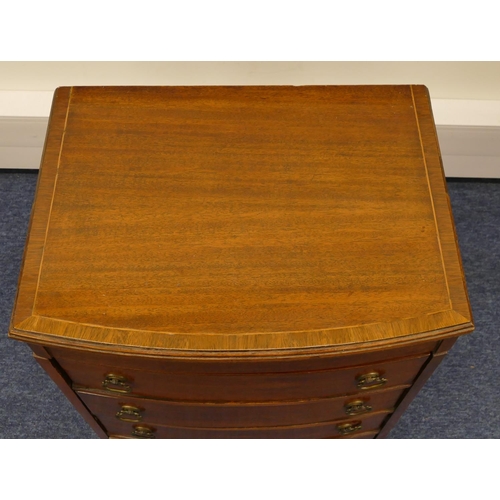 1163 - An Edwardian mahogany low bow fronted sewing chest with banded hinged top enclosing fitted interior,... 