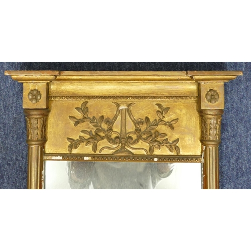 1165 - A 19th Century gilt rectangular shaped mirror with half round reeded column supports, harp and flora... 