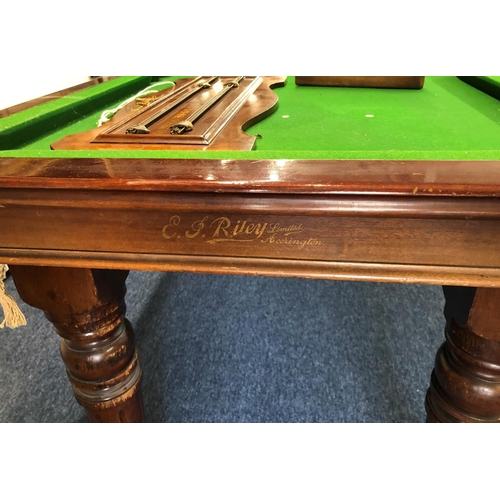 1173 - EJ Riley mahogany snooker dining table with 4 extra leaves, on round turned fluted legs, with score ... 