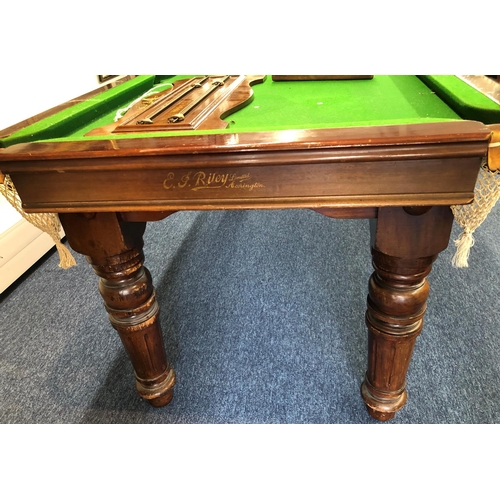 1173 - EJ Riley mahogany snooker dining table with 4 extra leaves, on round turned fluted legs, with score ... 