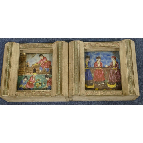 159 - A pair of early coloured tiles with raised figure decoration, mounted in frames inset with lamps, 28... 