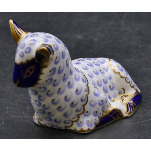 170 - A Royal Crown Derby paperweight in the form of a lamb on blue and white ground with gilt decoration,... 