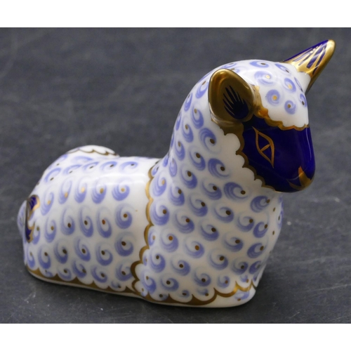 170 - A Royal Crown Derby paperweight in the form of a lamb on blue and white ground with gilt decoration,... 