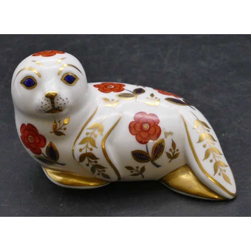 173 - A Royal Crown Derby paperweight in the form of a seal, 13cm long