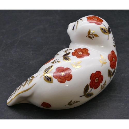 173 - A Royal Crown Derby paperweight in the form of a seal, 13cm long