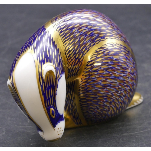 175 - A Royal Crown Derby paperweight in the form of a badger (no stopper), 8cm high