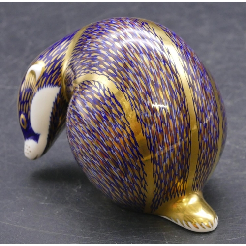 175 - A Royal Crown Derby paperweight in the form of a badger (no stopper), 8cm high