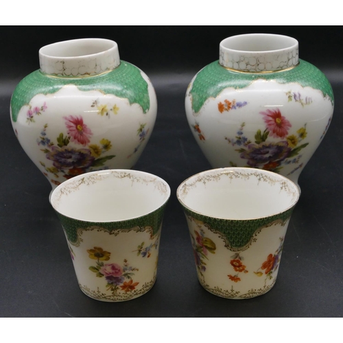 181 - A pair of Continental Dresden style small round bulbous thin necked vases on white and green ground ... 