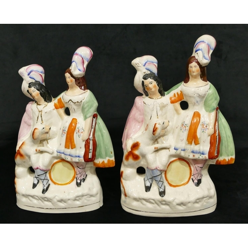 182 - 2 19th Century Staffordshire groups of seated gentleman and standing lady with dog and musical instr... 