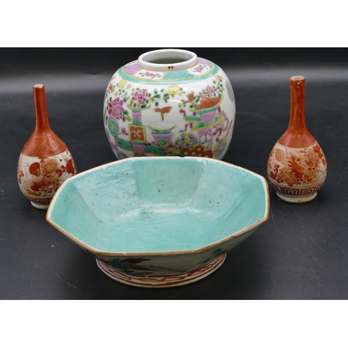 185 - An Oriental octagonal shallow bowl on white and green ground with multi-coloured floral and leaf dec... 