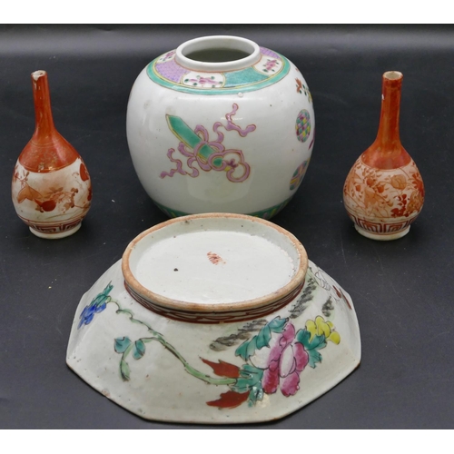 185 - An Oriental octagonal shallow bowl on white and green ground with multi-coloured floral and leaf dec... 