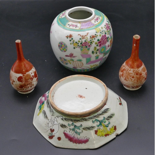 185 - An Oriental octagonal shallow bowl on white and green ground with multi-coloured floral and leaf dec... 