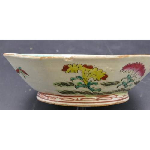 185 - An Oriental octagonal shallow bowl on white and green ground with multi-coloured floral and leaf dec... 