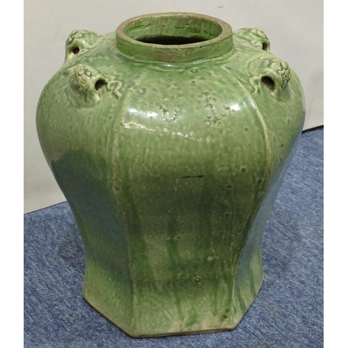 189 - A Chinese green glazed hexagonal bulbous shaped vase with raised animal head motifs, 30.5cm high.